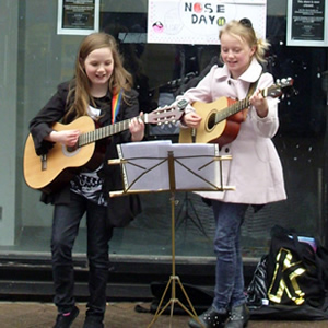 Students of Chris Stevens busking on the streets of Chester